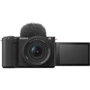 Sony ZV-E10 II Mirrorless Camera with lense full Front view of Sony ZV-E10 II vlogging camera with 16-50mm OSS II lens, top-mounted windscreen, and side-flipped LCD screen